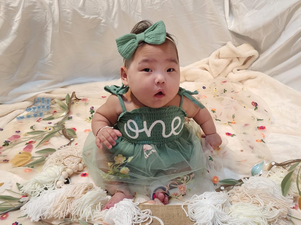 Baby Gracelyn in green dress