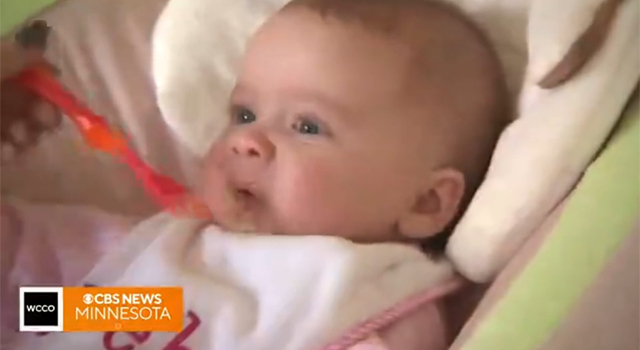 Baby getting spoon fed