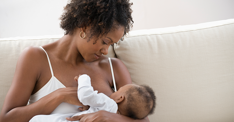 Mother nursing son