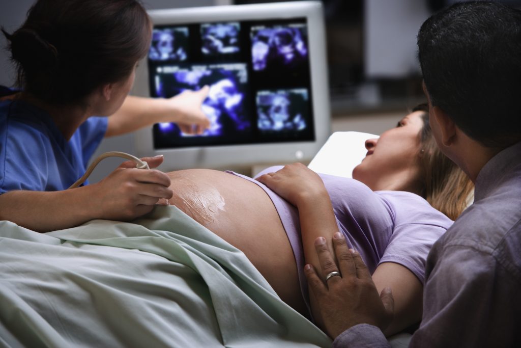 maternal-fetal medicine expert with pregnant person