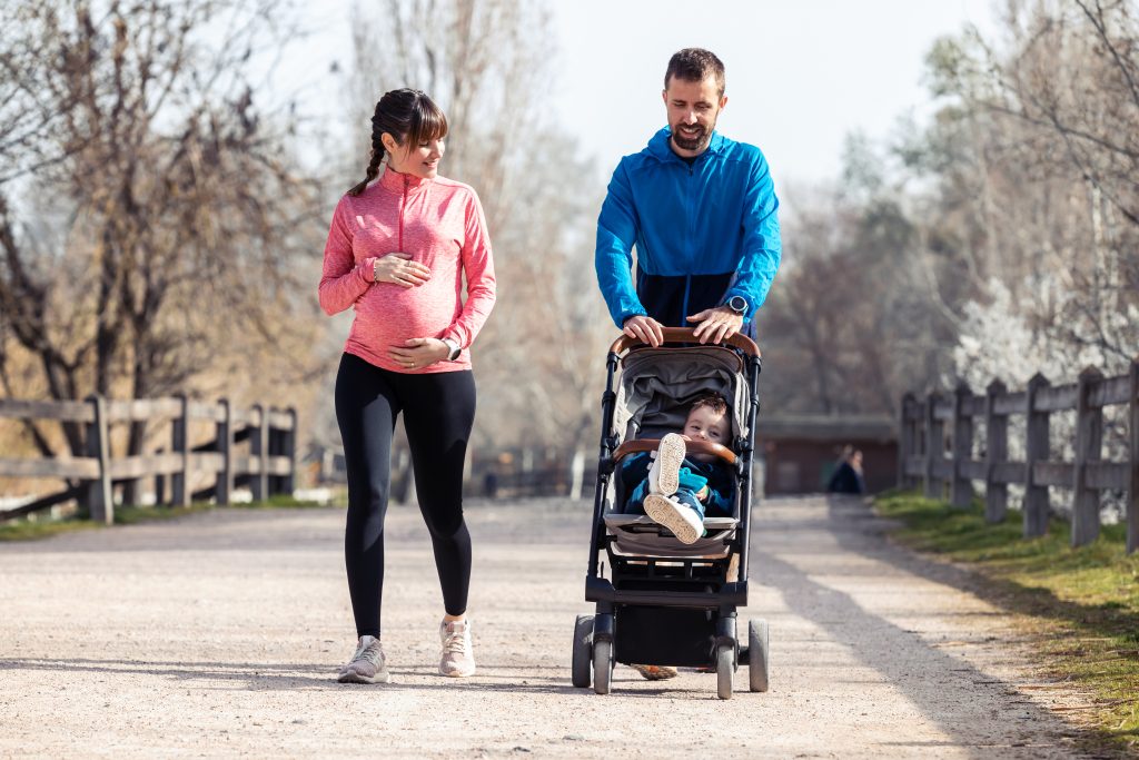 pregnant woman on a walk with family