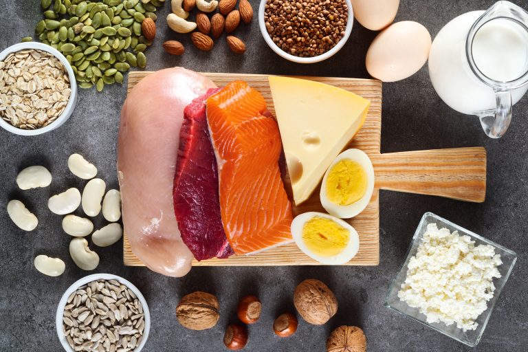 High protein food as meat, fish, dairy, eggs, buckwheat, oatmeal, nuts, bean, pumpkin seed and sunflower seed. Top view.