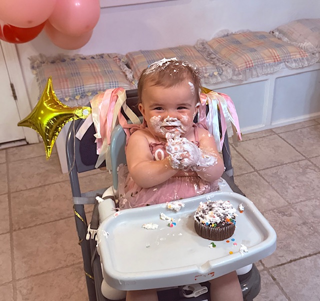 Lucy eating birthday cake