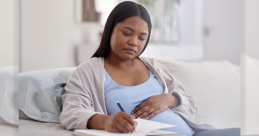 Pregnant woman making a list