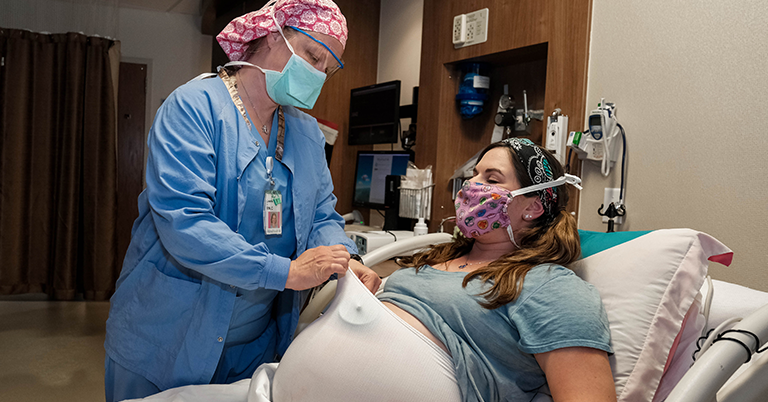 provider helping pregnant person