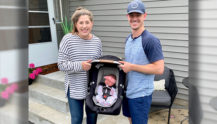 Lauren Hall and her husband with their new baby, Allison