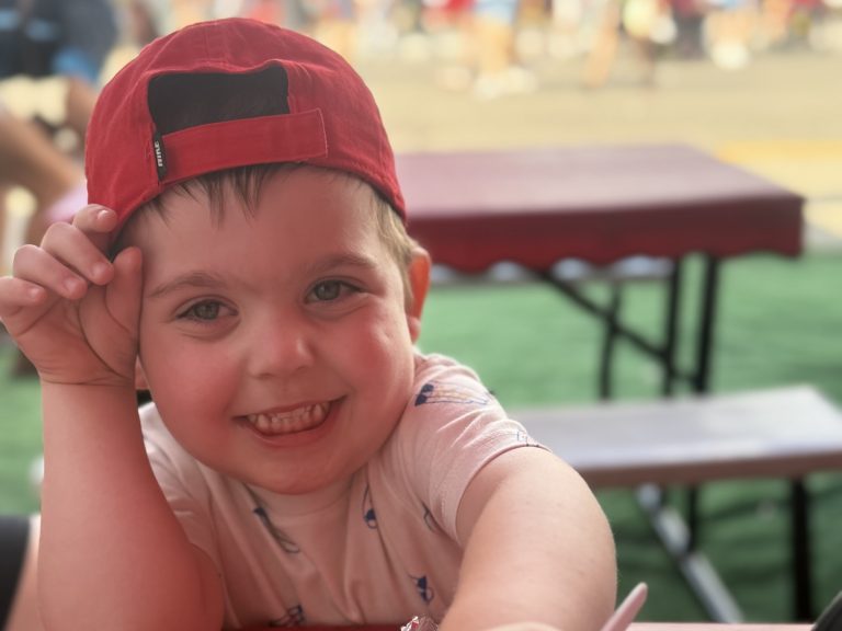 smiling William in a hat